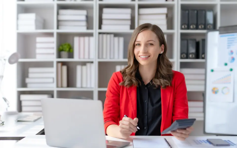 happy-young-businesswoman-sittin