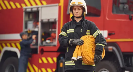 holding-fire-hose-woman-in-uniform-is-at-work-in-2023-11-27-05-02-00-utc