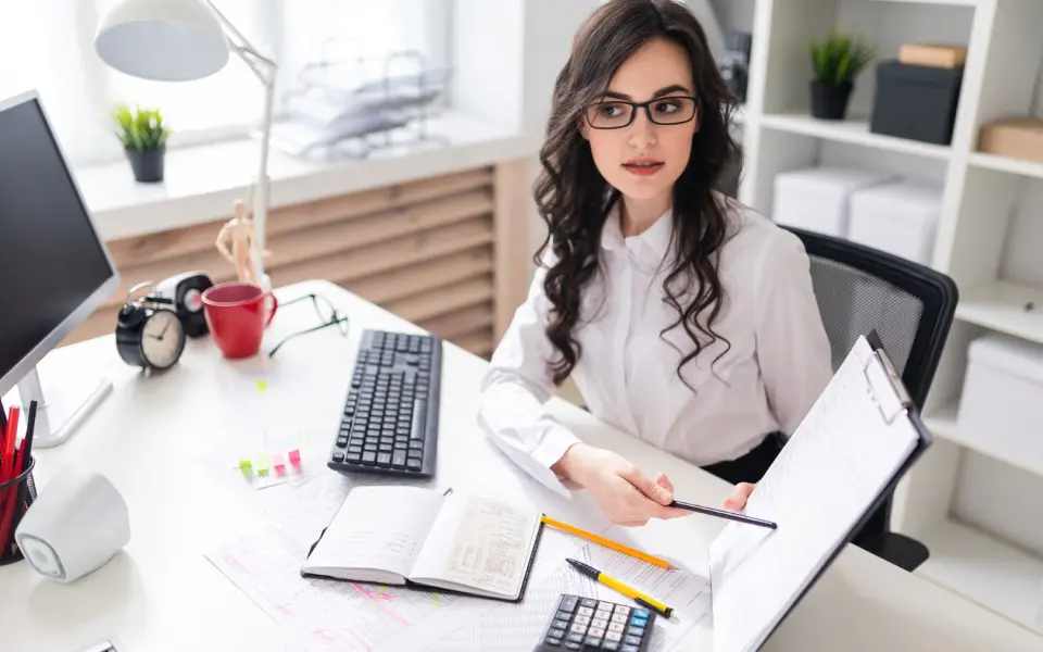a-beautiful-young-girl-is-sitting-at-a-table-in-th-2023-11-27-05-16-24-utc(1)