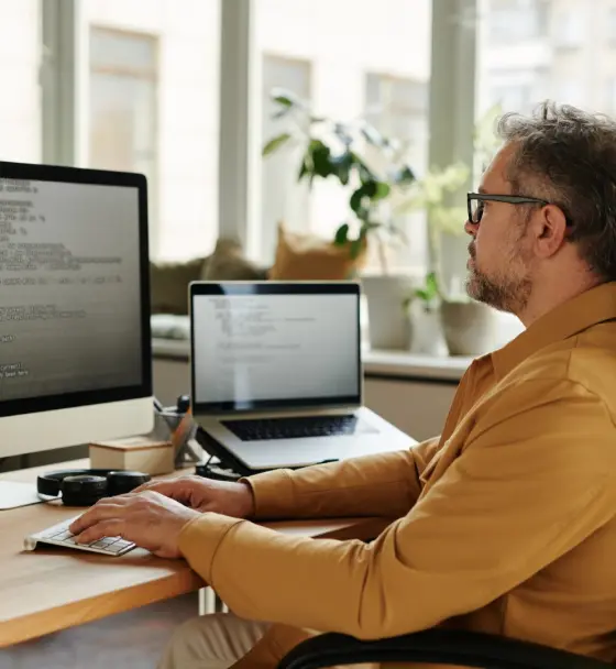 serious-mature-software-developer-looking-at-code-2023-11-27-05-20-59-utc