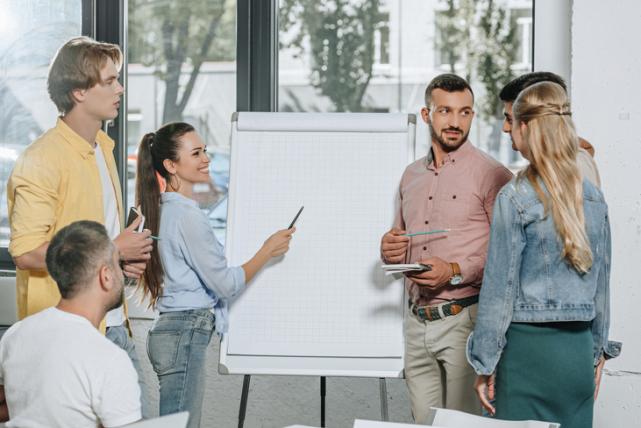 young-businesspeople-standing-ne