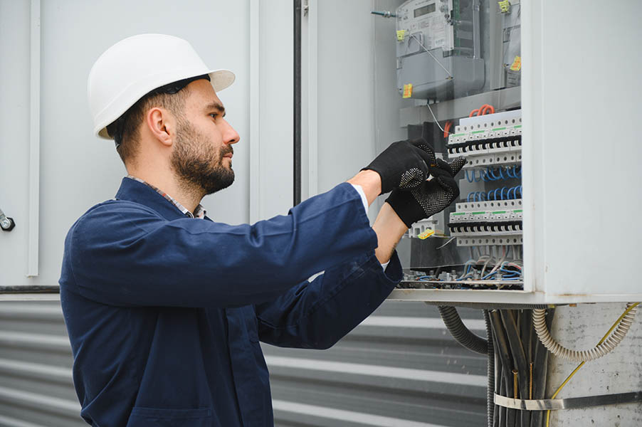 a-male-electrician-works-in-a-switchboard.jpg