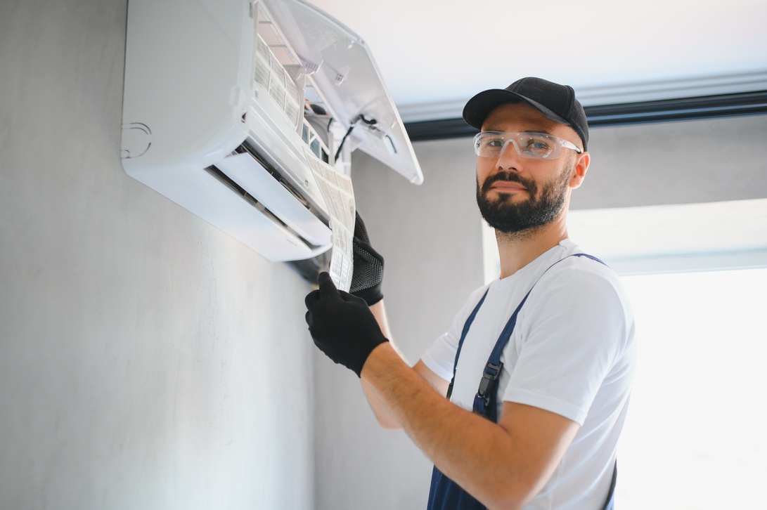 happy-male-technician-repairing-.jpg
